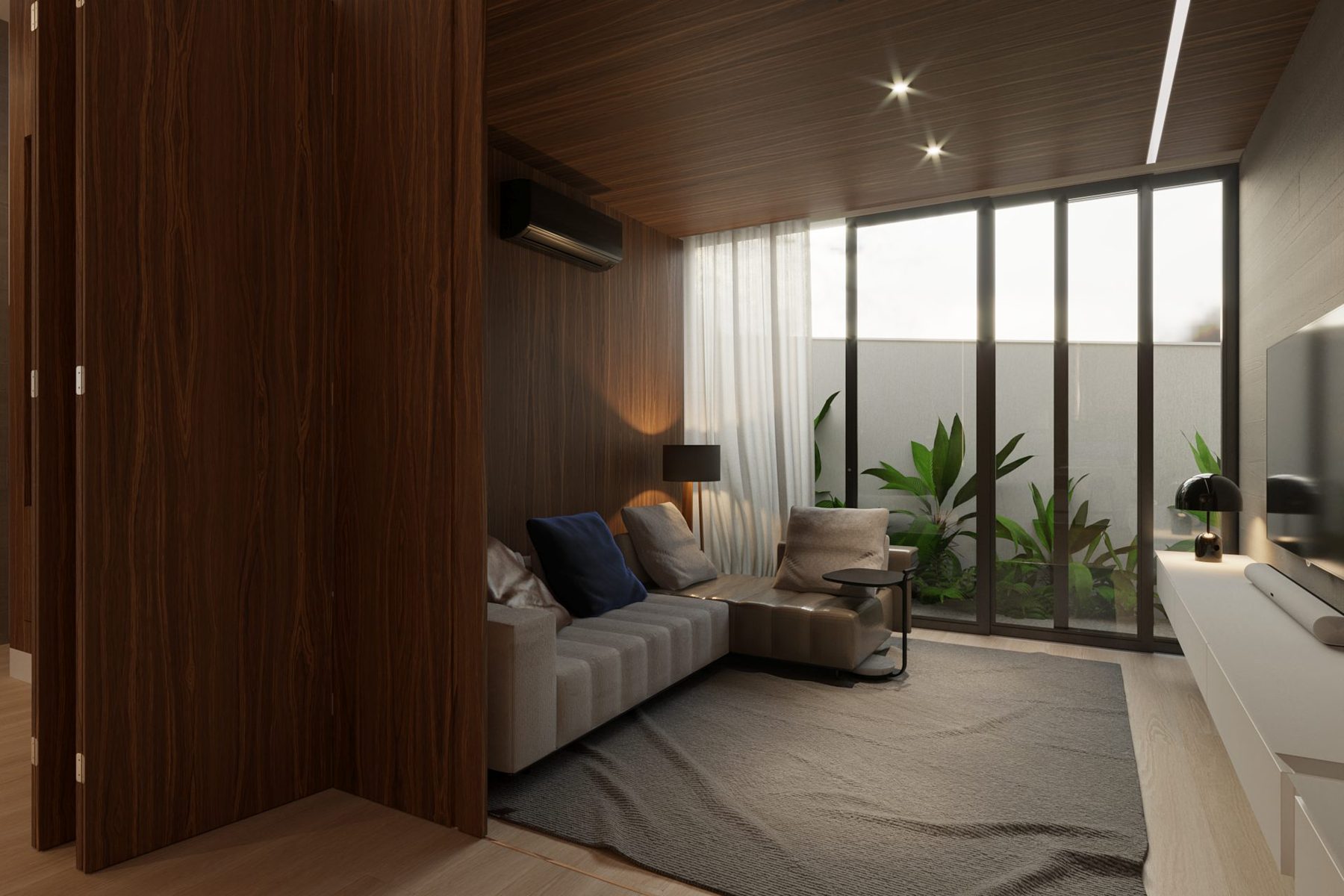 A sala de TV · o sofá e o jardim